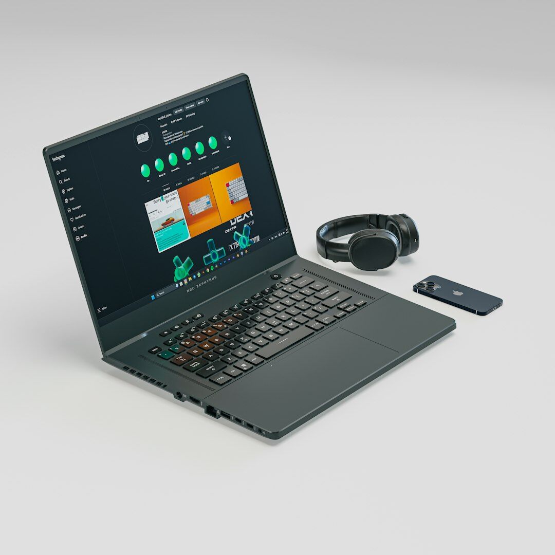 Hands typing on laptop showing business charts